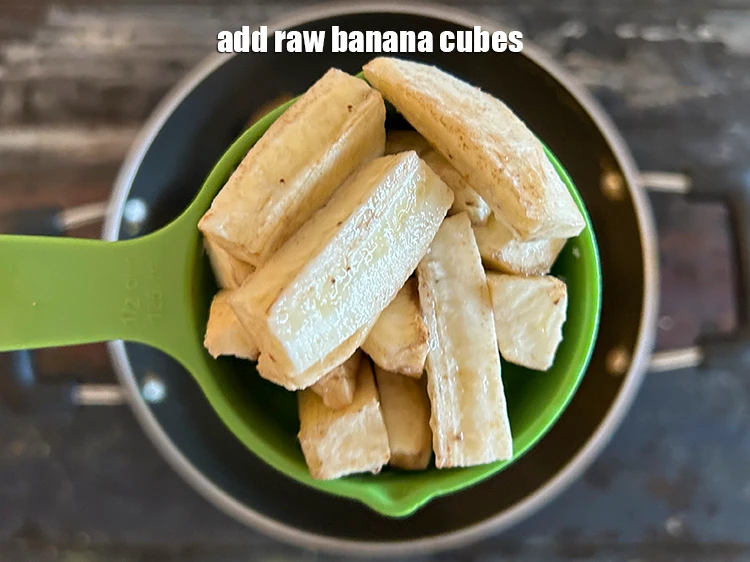 Step 12 – <p>Add <span style="background-color:rgb(255,255,255);color:rgb(0,0,0);">1/2 cup raw </span><a href="https://www.tarladalal.com/glossary-banana-kela-17i#ing_2963"><u>banana cubes</u></a><u>.</u></p>