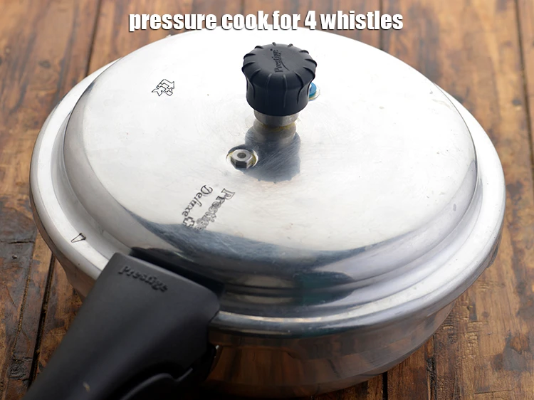 Step 8 – <p><span style="background-color:rgb(255,255,255);color:rgb(0,0,0);">Pressure cook for 4 whistles.</span></p>