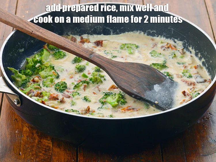 Step 9 – <p><span style="background-color:rgb(255,255,255);color:rgb(0,0,0);">Add the 1 cup </span><a href="https://www.tarladalal.com/glossary-broccoli-232i#ing_2325"><u>blanched broccoli florets</u></a><span style="background-color:rgb(255,255,255);color:rgb(0,0,0);">, 5 tbsp </span><a href="https://www.tarladalal.com/glossary-sun-dried-tomatoes-1994i#ing_2629"><u>soaked and …