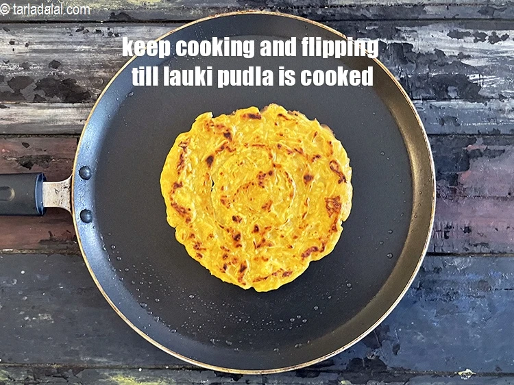 Step 18 – <p>Keep cooking and flipping pudla till golden brown. <strong>Lauki chilla&nbsp;</strong>is cooked.</p>