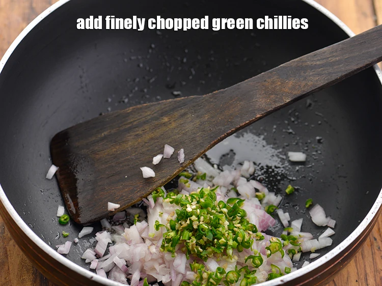 Step 13 – <p>Add the <span style="background-color:rgb(255,255,255);color:rgb(0,0,0);">1 tbsp finely </span><a href="https://www.tarladalal.com/glossary-green-chillies-hari-mirch-331i#ing_2388"><u>chopped green chillies</u></a>. Add as per your preference.</p>