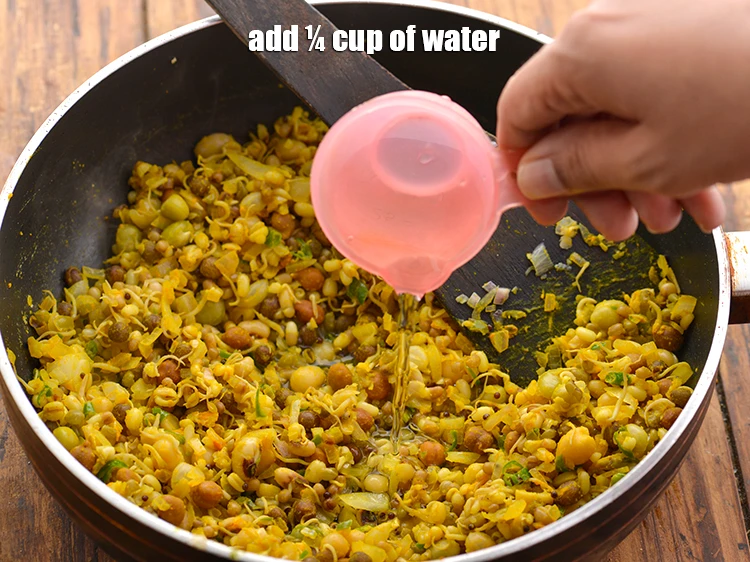 Step 20 – <p>Add ¼ cup of <strong>water</strong>. Do not add more water as the poha will soak …