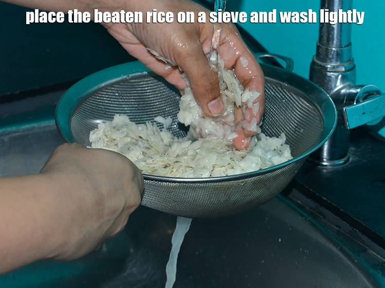 Step 8 – <p>Place the <strong>beaten rice</strong> on a sieve under a running tap and wash lightly to …