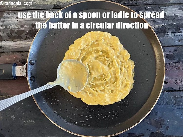 Step 21 – <p>Use the back of the ladle or&nbsp;spoon to spread the batter in a circular direction.&nbsp;</p>