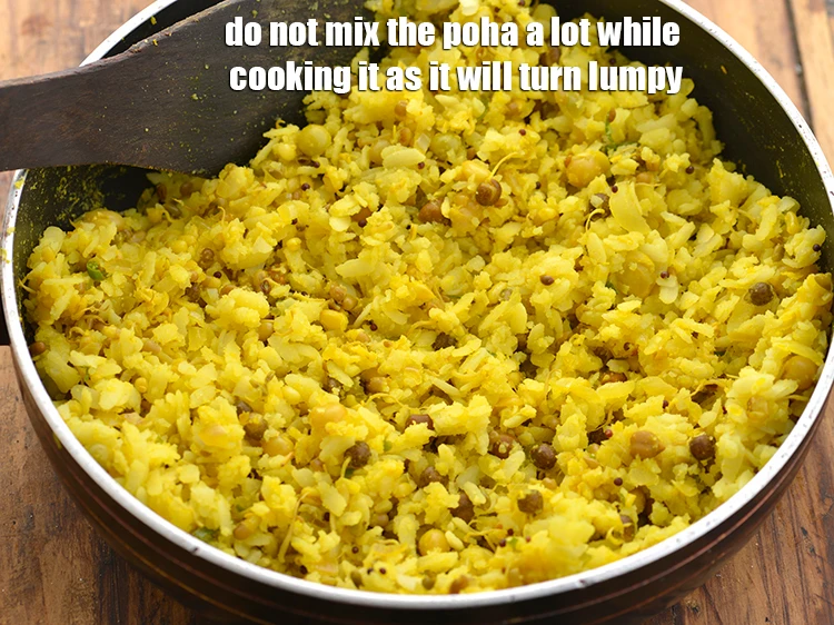 Step 29 – <p>Do not mix the <strong>poha</strong> a lot while cooking it as it will turn lumpy.&nbsp;</p>