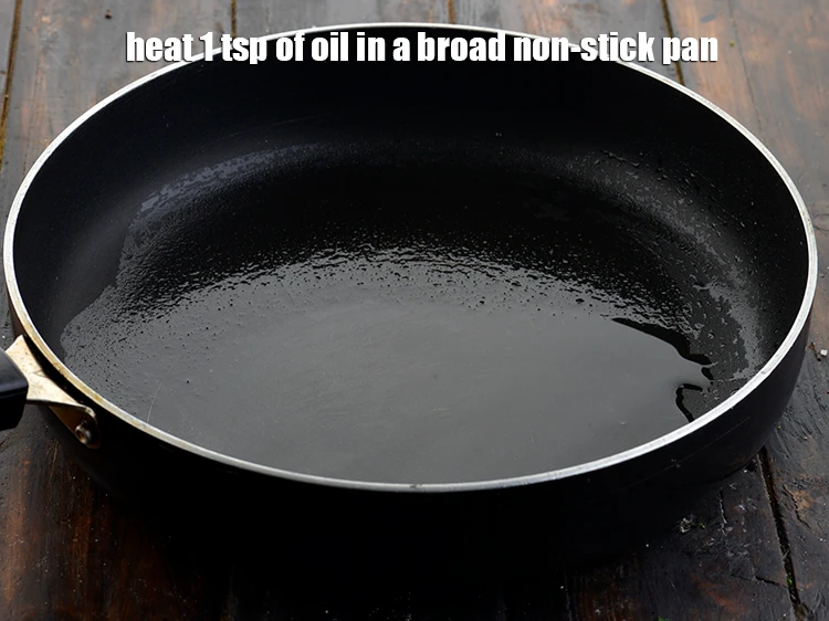 Step 11 – <p><span style="background-color:rgb(255,255,255);color:rgb(0,0,0);">Heat 1 tsp of </span><a href="https://www.tarladalal.com/glossary-oil-671i"><u>oil&nbsp;</u></a><span style="background-color:rgb(255,255,255);color:rgb(0,0,0);"> in a broad non-stick pan.</span></p>