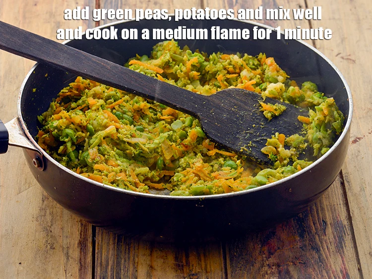 Step 15 – <p><span style="background-color:rgb(255,255,255);color:rgb(0,0,0);">Add the 1/2 cup </span><a href="https://www.tarladalal.com/glossary-green-peas-matar-hare-matar-vatana-180i#ing_2545"><u>boiled and mashed green peas</u></a><span style="background-color:rgb(255,255,255);color:rgb(0,0,0);">, 1/4 cup </span><a …