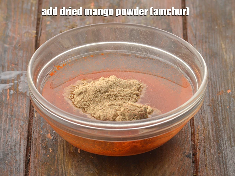 Step 22 – <p>Add <span style="background-color:rgb(255,255,255);color:rgb(0,0,0);">1 tsp </span><a href="https://www.tarladalal.com/glossary-dried-mango-powder-amchur-powder-148i"><u>dried mango powder (amchur)</u></a><u>.</u></p>