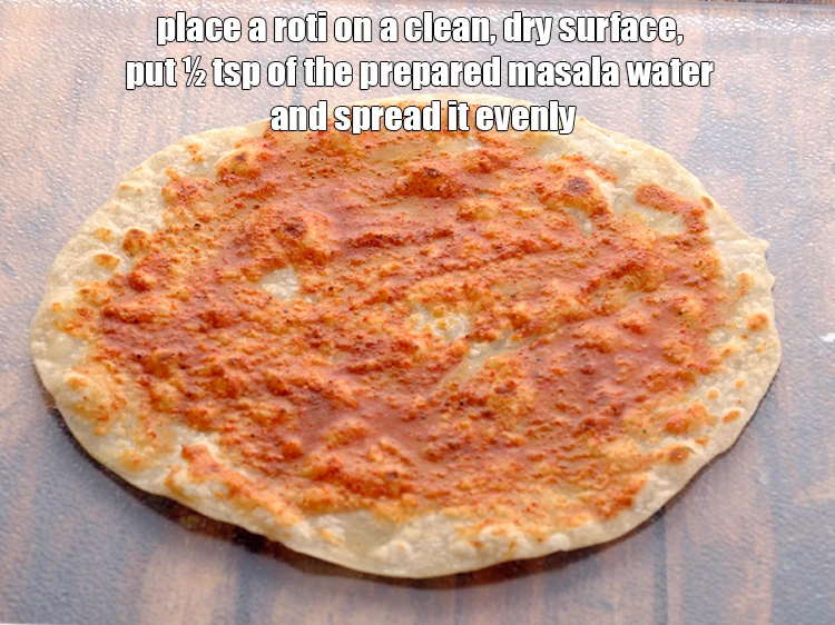 Step 24 – <p>To make the <strong>Mixed Vegetable Frankie, Low Salt Recipe</strong>, Place a <strong>roti </strong>on a clean, …