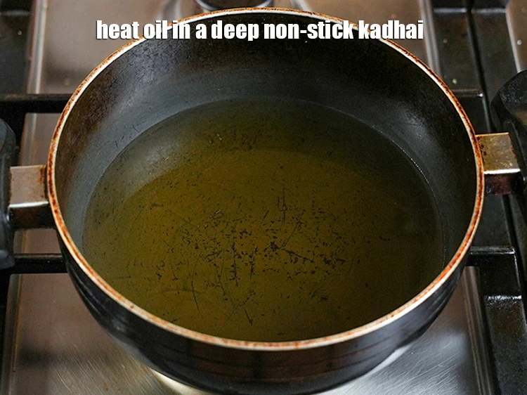 Step 25 – <p>Heat the <a href="https://www.tarladalal.com/glossary-oil-671i"><u>oil&nbsp;</u></a> in a deep non-stick kadhai.</p>