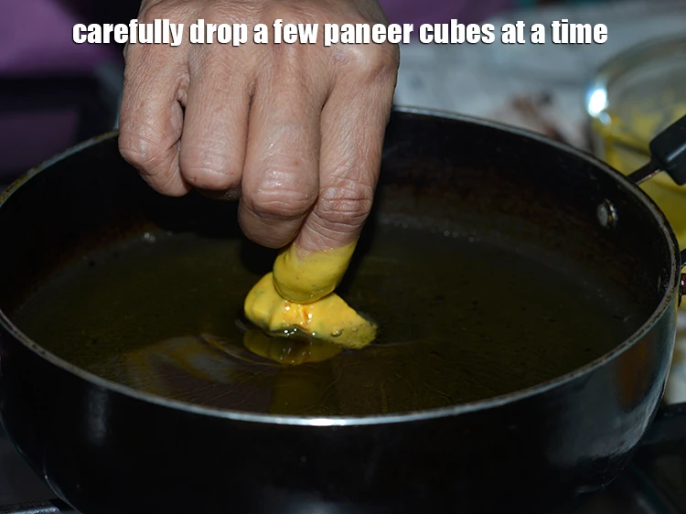Step 27 – <p>Carefully drop a few paneer cubes at a time. Fry the <strong>Paneer pakoras</strong> in small …