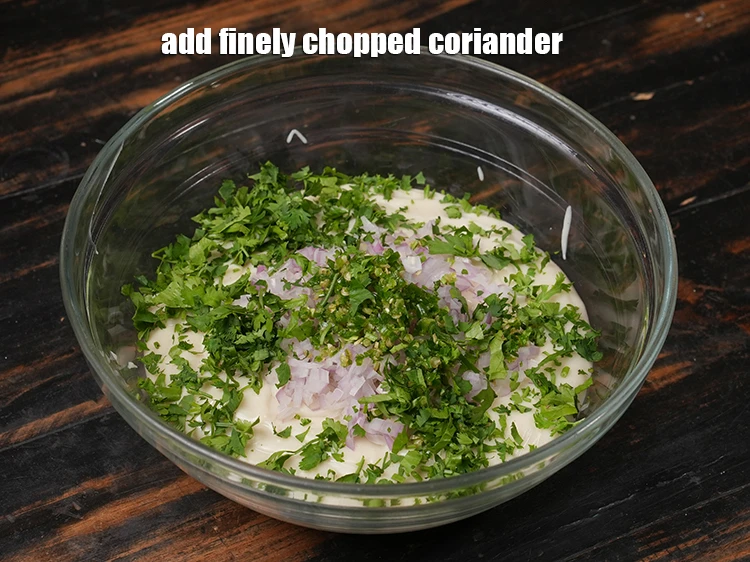 Step 12 – <p>Add <span style="background-color:rgb(255,255,255);color:rgb(0,0,0);">2 tbsp </span><a href="https://www.tarladalal.com/glossary-coriander-dhania-kothmir-369i#ing_3500"><u>finely chopped coriander</u></a><u>.</u></p>