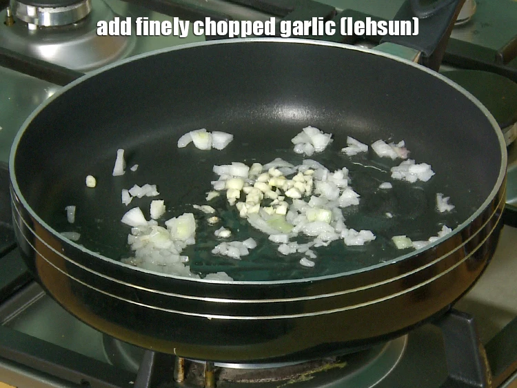 Step 16 – <p><span style="background-color:rgb(255,255,255);color:rgb(0,0,0);">Add 1 tbsp finely </span><a href="https://www.tarladalal.com/glossary-garlic-lehsun-lahsun-348i#ing_2370"><u>chopped garlic (lehsun)</u></a>.</p>