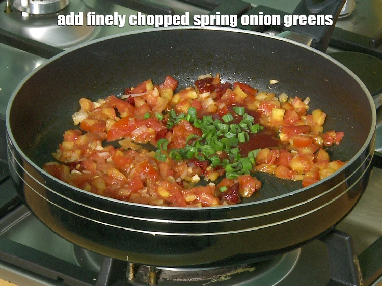 Step 24 – <p>Add <span style="background-color:rgb(255,255,255);color:rgb(0,0,0);">1 tbsp finely </span><a href="https://www.tarladalal.com/glossary-spring-onion-greens-hare-pyaz-ke-patte-445i#ing_2424"><u>chopped spring onion greens</u></a><u>.</u></p>