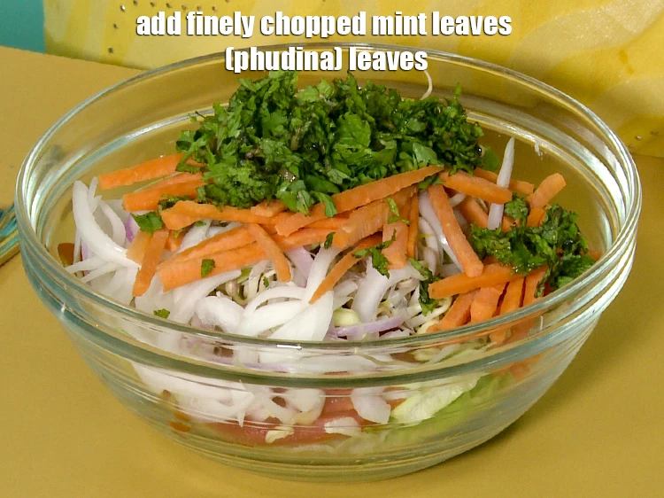 Step 35 – <p>Add <span style="background-color:rgb(255,255,255);color:rgb(0,0,0);">2 tbsp finely </span><a href="https://www.tarladalal.com/glossary-mint-leaves-pudina-phudina-521i#ing_2368"><u>chopped mint leaves (phudina) </u></a><span style="background-color:rgb(255,255,255);color:rgb(0,0,0);">leaves.</span></p>