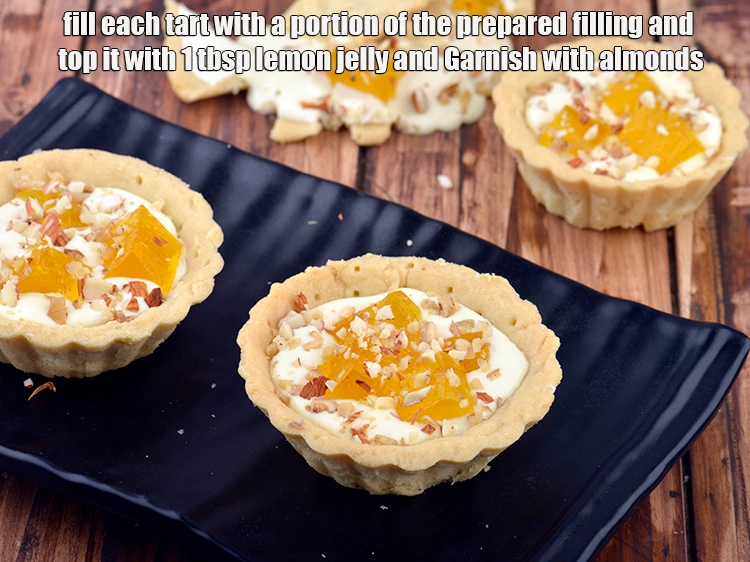 Step 6 – <p><strong>Just before serving,</strong> fill each <a href="https://www.tarladalal.com/eggless-tarts-1135r"><strong><u>tarts</u></strong></a> with a portion of the <strong>prepared filling</strong> and …