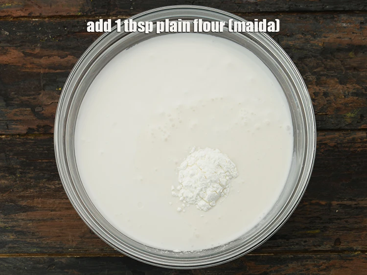 Step 2 – <p>Add <span style="background-color:rgb(255,255,255);color:rgb(0,0,0);">1 tbsp </span><a href="https://www.tarladalal.com/glossary-plain-flour-maida-188i"><u>plain flour (maida)</u></a><u>.</u></p>