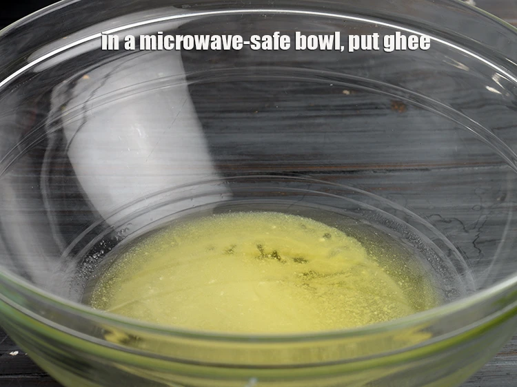 Step 4 – <p>In a <strong>microwave-safe bowl</strong>, put <span style="background-color:rgb(255,255,255);color:rgb(0,0,0);">1 tsp </span><a href="https://www.tarladalal.com/glossary-ghee-245i"><u>ghee</u></a><u>.</u></p>