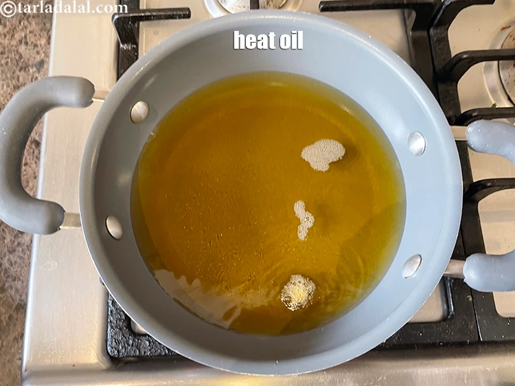 Step 14 – <p>Heat the oil in a deep non-stick pan.</p>
