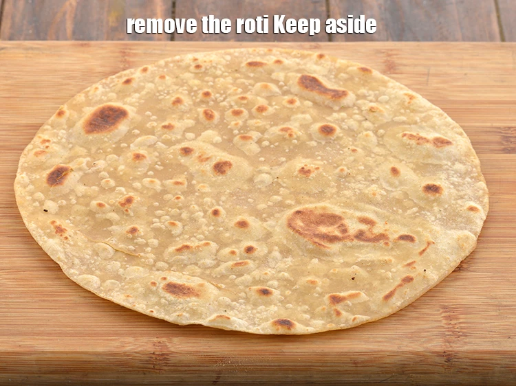 Step 15 – <p>Take the roti <strong>(roti for wraps and rolls)</strong> off the heat and repeat with the …