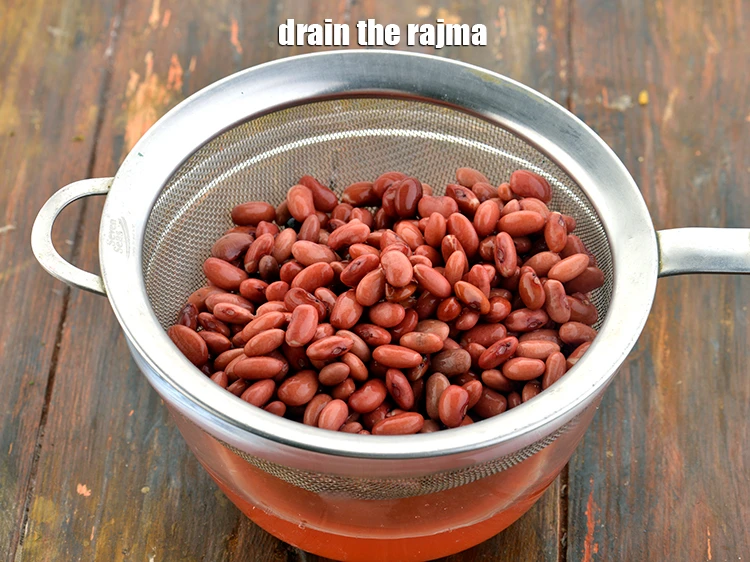 Step 17 – <p>Drain the <strong>rajma</strong> using a strainer and discard the water.</p>
