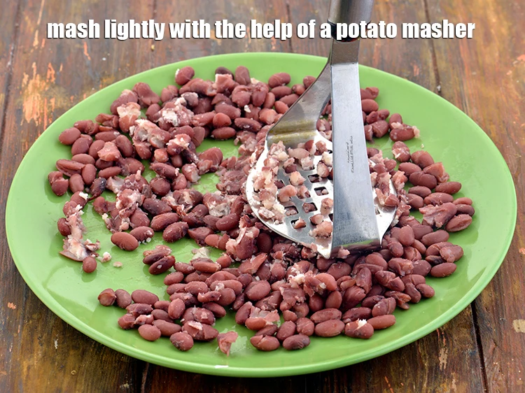 Step 24 – <p>Mash lightly with the help of a potato masher.</p>