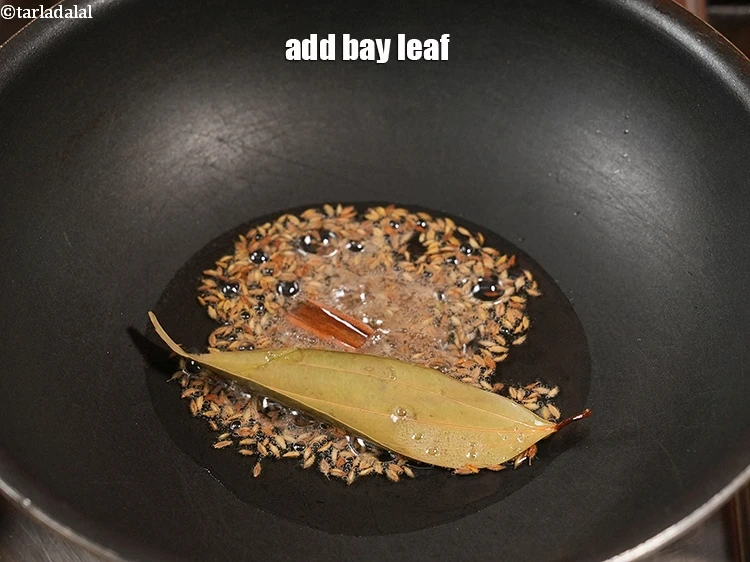 Step 19 – <p>Add 1 <a href="https://www.tarladalal.com/glossary-bay-leaf-tejpatta-bay-leaves-189i">bay leaf (tejpatta)</a>.</p>