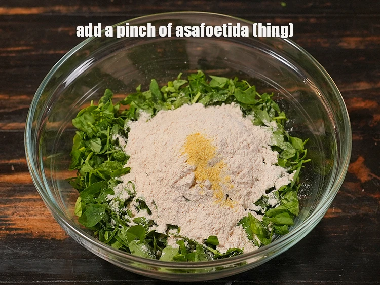 Step 12 – <p>Add <span style="background-color:rgb(255,255,255);color:rgb(0,0,0);">a pinch of </span><a href="https://www.tarladalal.com/glossary-asafoetida-hing-113i"><u>asafoetida (hing)</u></a></p>