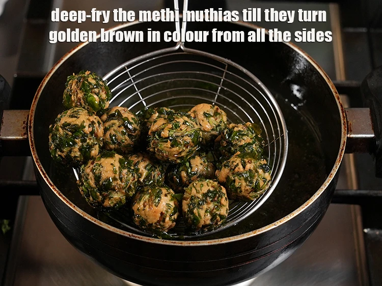 Step 20 – <p><span style="background-color:rgb(255,255,255);color:rgb(0,0,0);">Deep-fry the <strong>methi muthias</strong> till they turn golden brown in colour from all the …