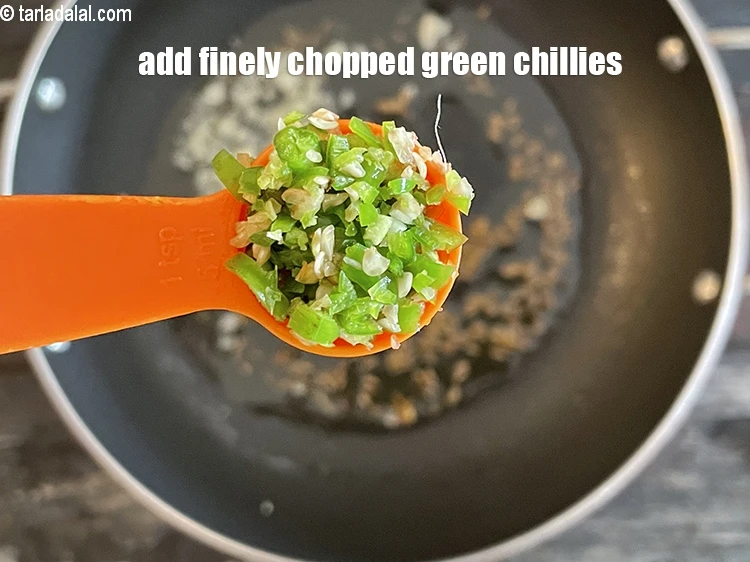 Step 23 – <p>Add <strong>1&nbsp;tsp</strong>&nbsp;finely&nbsp;<a href="glossary-chopped-green-chilli-820i">chopped green chillies</a>.</p>