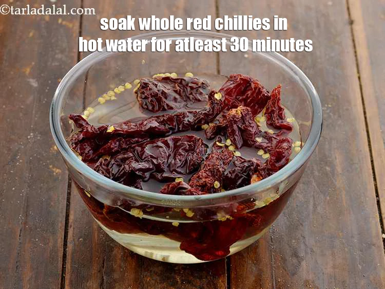 Step 2 – <p><strong>Soak</strong> around 12-15 whole <strong>red chillies</strong> in enough <strong>hot water</strong> for atleast 30 minutes.</p>