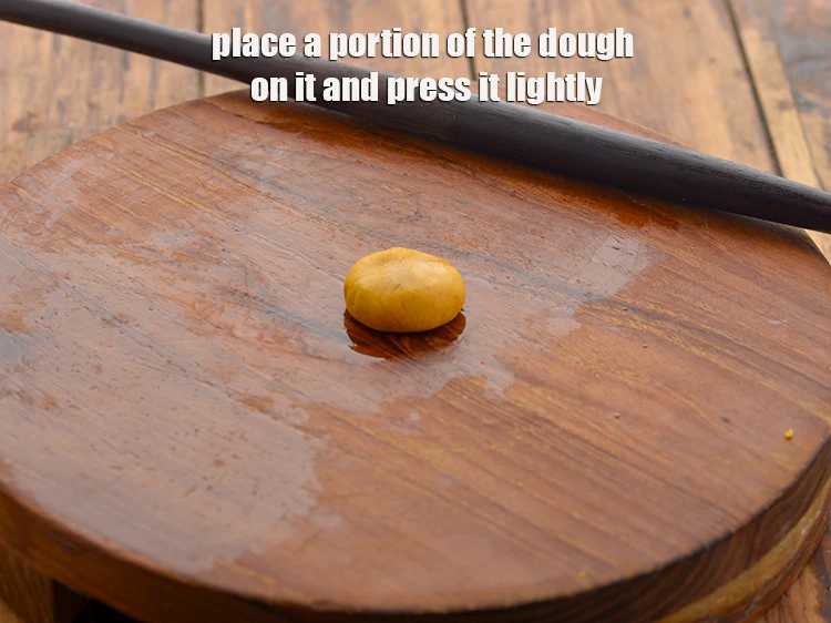 Step 13 – <p>Place a portion of the <strong>dough</strong> on it and press it lightly.</p>