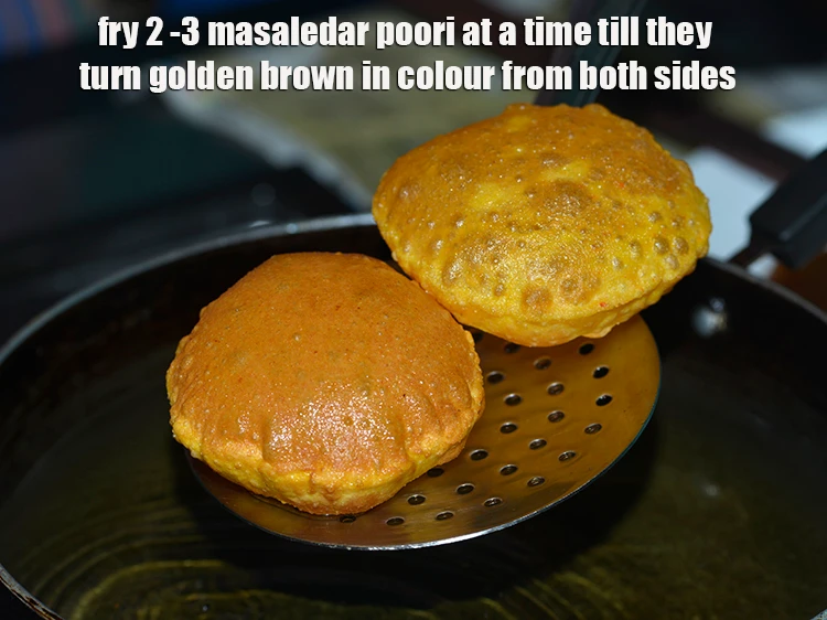 Step 17 – <p>Fry 2 -3 <strong>masaledar poori</strong> at a time till they turn golden brown in colour …