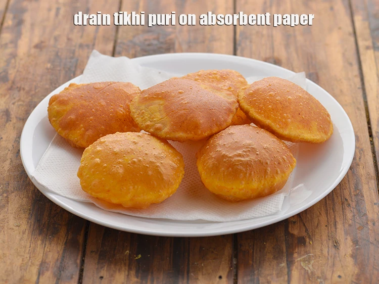 Step 18 – <p>Drain the <strong>Gujarati tikhi puri</strong> on absorbent paper.</p>