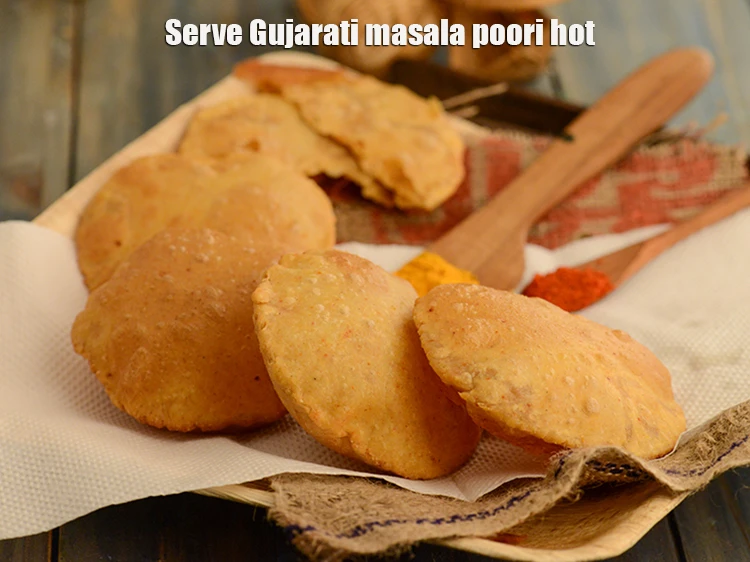 Step 19 – <p>Serve the <strong>Gujarati</strong>&nbsp;<strong>masala poori</strong> hot. You can enjoy the <strong>poori</strong> with&nbsp;<a href="https://www.tarladalal.com/quick-mango-chunda--aam-ka-chunda-gujarat-raw-mango-sweet-pickle-3429r">Quick Mango Chunda</a>, <a …
