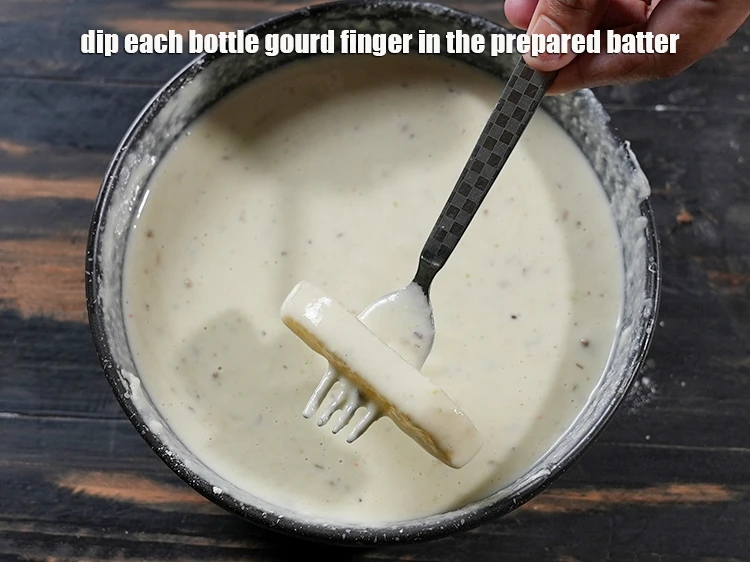 Step 10 – <p><span style="background-color:rgb(255,255,255);color:rgb(0,0,0);">Dip each <strong>bottle gourd finger</strong> in the prepared batter.</span></p>