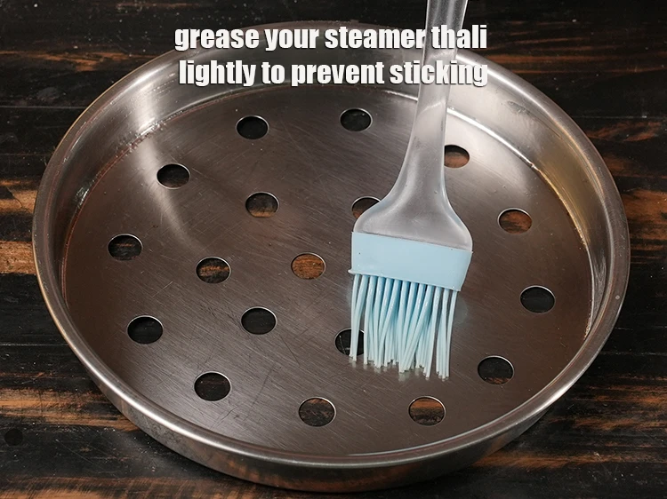 Step 15 – <p><span style="background-color:rgb(255,255,255);color:rgb(0,0,0);">Grease your steamer thali lightly to prevent sticking.</span></p>