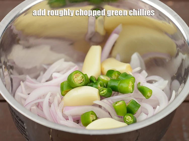 Step 26 – <p>Add <span style="background-color:rgb(255,255,255);color:rgb(0,0,0);">1/2 tbsp roughly </span><a href="https://www.tarladalal.com/glossary-green-chillies-hari-mirch-331i#ing_2388"><u>chopped green chillies</u></a><u>.</u></p>