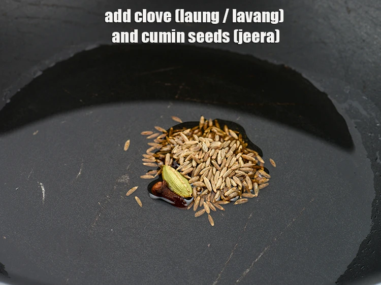 Step 31 – <p>Add <span style="background-color:rgb(255,255,255);color:rgb(0,0,0);">2 </span><a href="https://www.tarladalal.com/glossary-cloves-laung-lavang-322i"><u>clove (laung / lavang)</u></a> and <span style="background-color:rgb(255,255,255);color:rgb(0,0,0);">1/2 tsp </span><a href="https://www.tarladalal.com/glossary-cumin-seeds-jeera-zeera-381i"><u>cumin seeds …
