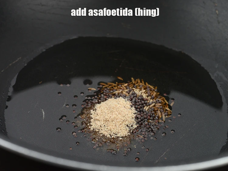 Step 33 – <p>Add <span style="background-color:rgb(255,255,255);color:rgb(0,0,0);">1/4 tsp </span><a href="https://www.tarladalal.com/glossary-asafoetida-hing-113i"><u>asafoetida (hing)</u></a><u>.</u></p>