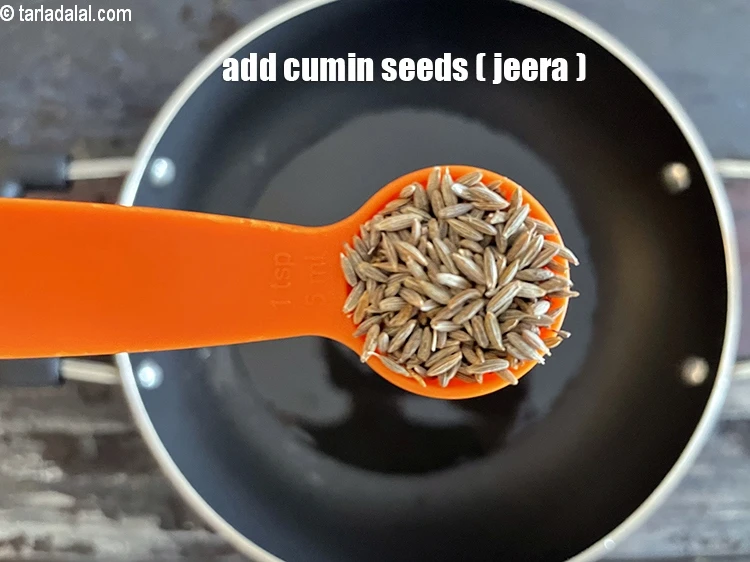 Step 12 – <html><head></head><body><p>Add&nbsp;1 tsp&nbsp;<a href="glossary-cumin-seeds-jeera-zeera-381i">cumin seeds (jeera)</a>.</p></body></html>