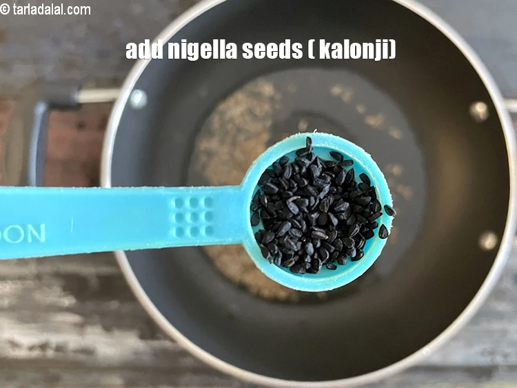 Step 14 – <html><head></head><body><p>Add&nbsp;1/2 tsp&nbsp;<a href="glossary-nigella-seeds-kalonji-onion-seeds-552i">nigella seeds (kalonji)</a>.</p></body></html>