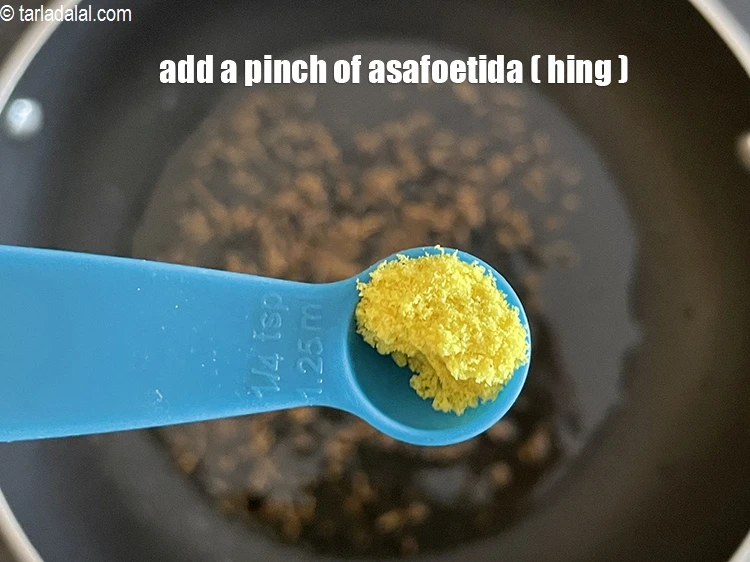 Step 16 – <html><head></head><body><p>Add&nbsp;a pinch of&nbsp;<a href="glossary-asafoetida-hing-113i">asafoetida (hing)</a>.</p></body></html>