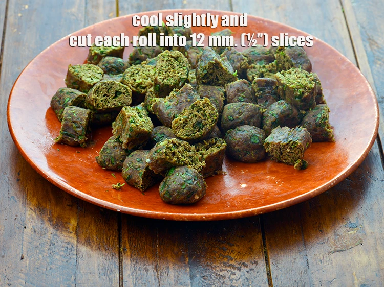 Step 20 – <p><strong>Cool slightly</strong> and <strong>cut</strong> each roll into 12 mm. (½”) slices and keep aside.</p>