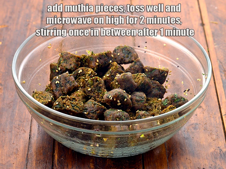 Step 24 – <p><span style="background-color:rgb(255,255,255);color:rgb(0,0,0);">Add the <strong>muthia pieces</strong>, toss well and <strong>microwave</strong> on high for 2 minutes, stirring …