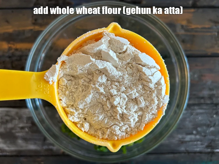 Step 3 – <p>Add <span style="background-color:rgb(255,255,255);color:rgb(0,0,0);">3/4 cup </span><a href="https://www.tarladalal.com/glossary-whole-wheat-flour-gehun-ka-atta-gehun-ka-aata-429i"><u>whole wheat flour (gehun ka atta)</u></a><u>.</u></p>