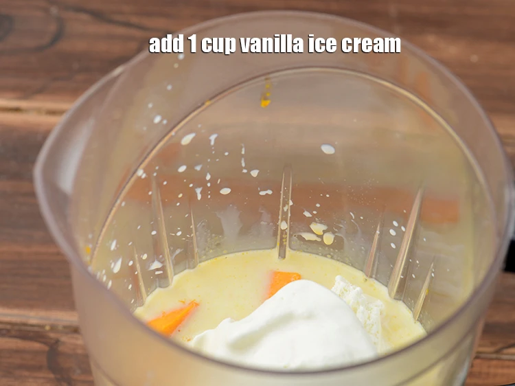 Step 5 – <p>Add <span style="background-color:rgb(255,255,255);color:rgb(0,0,0);">1 cup </span><a href="https://www.tarladalal.com/glossary-Vanilla-ice-cream-1887i"><u>vanilla ice cream</u></a><u>.</u></p>