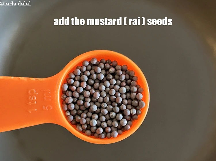 Step 27 – <html><head></head><body><p>Add 1 tsp&nbsp;<a href="glossary-mustard-seeds-sarson-rai-sarson-ke-beej-525i">mustard seeds ( rai / sarson)</a>.</p></body></html>
