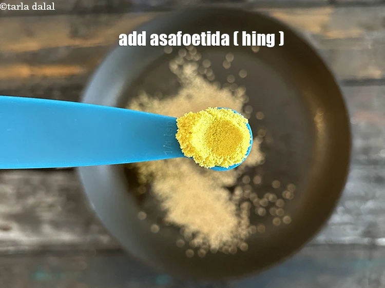 Step 29 – <html><head><meta charset="UTF-8"></head><body><p>Add 1/4 tsp&nbsp;<a href="glossary-asafoetida-hing-113i">asafoetida (hing)</a>.</p></body></html>