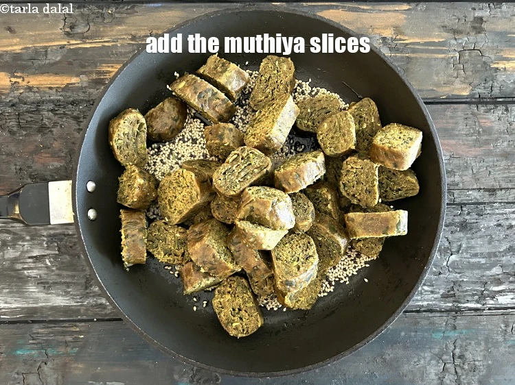 Step 31 – <p>Add the muthia slices.</p>